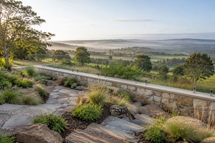 Glass balustrade overlooking rolling countryside